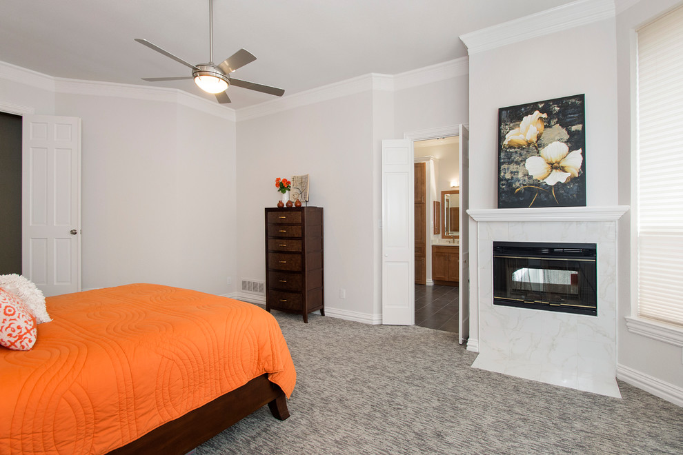 Example of a mid-sized classic master carpeted and gray floor bedroom design in Dallas with gray walls, a two-sided fireplace and a tile fireplace