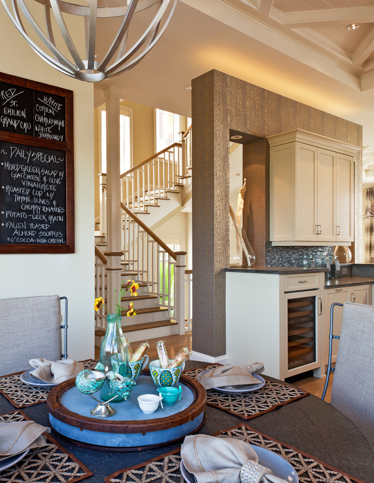Photo of a mid-sized beach style open plan dining in Phoenix with beige walls, light hardwood floors and brown floor.