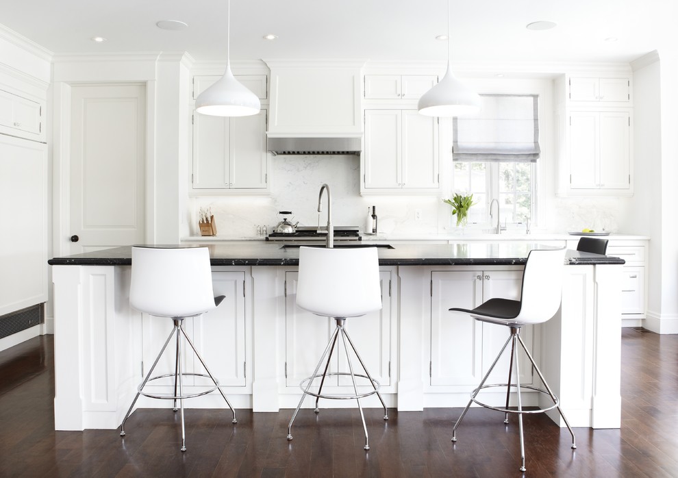 This is an example of a mid-sized transitional single-wall separate kitchen in Toronto with an undermount sink, white cabinets, white splashback, panelled appliances, stone slab splashback, beaded inset cabinets, quartz benchtops, dark hardwood floors and with island.