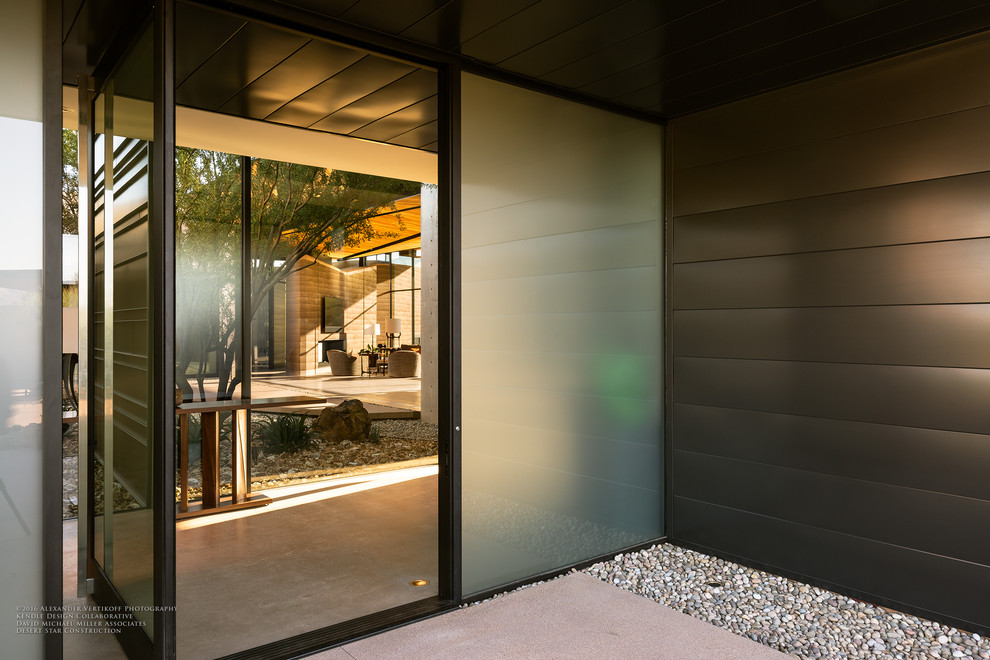 Front door - mid-sized modern front door idea in Phoenix with a glass front door