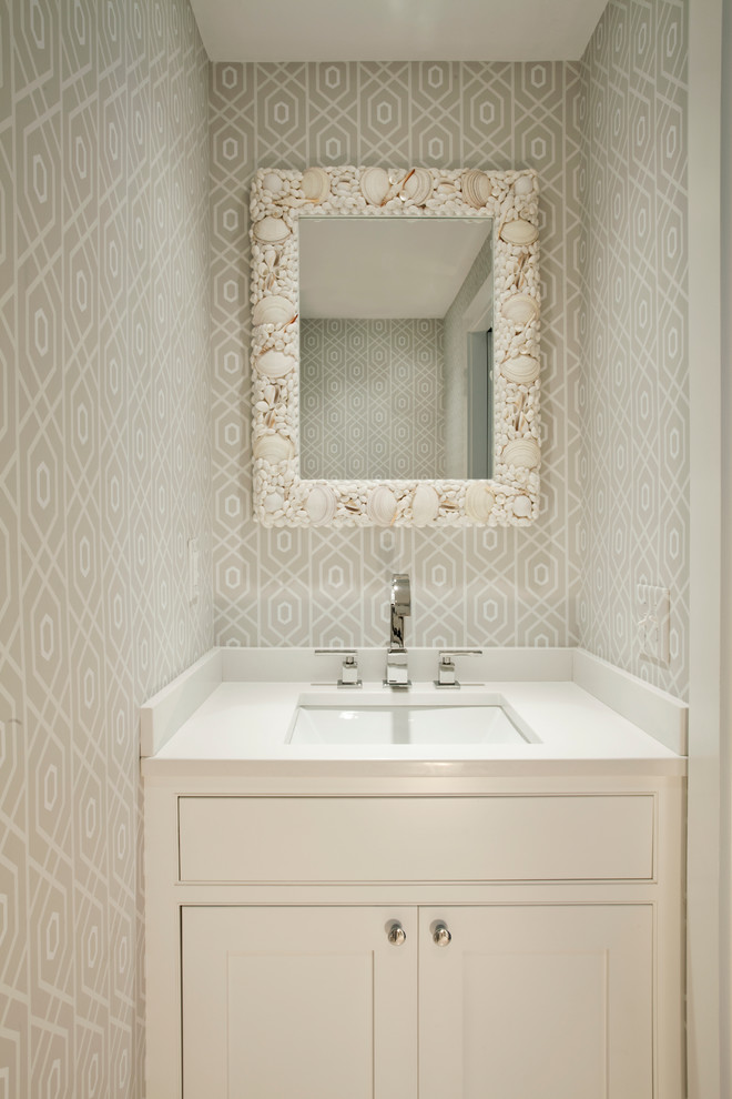 Inspiration for a beach style powder room in Boston with an undermount sink, shaker cabinets, beige walls and beige cabinets.