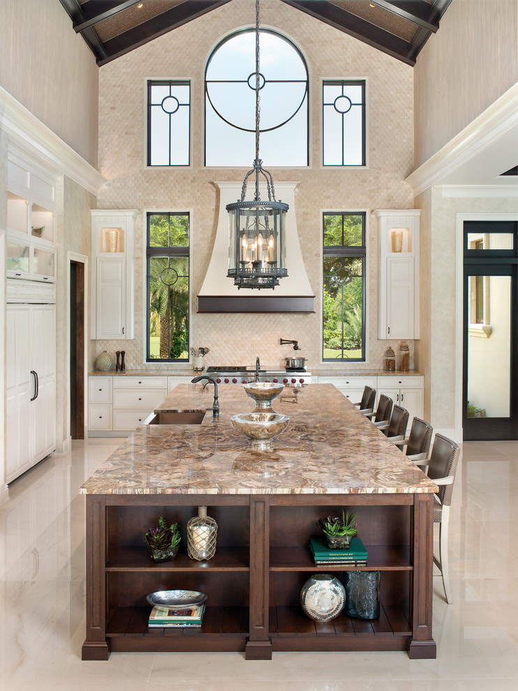 Inspiration for a large transitional l-shaped open plan kitchen in Miami with a farmhouse sink, stone tile splashback, stainless steel appliances and with island.