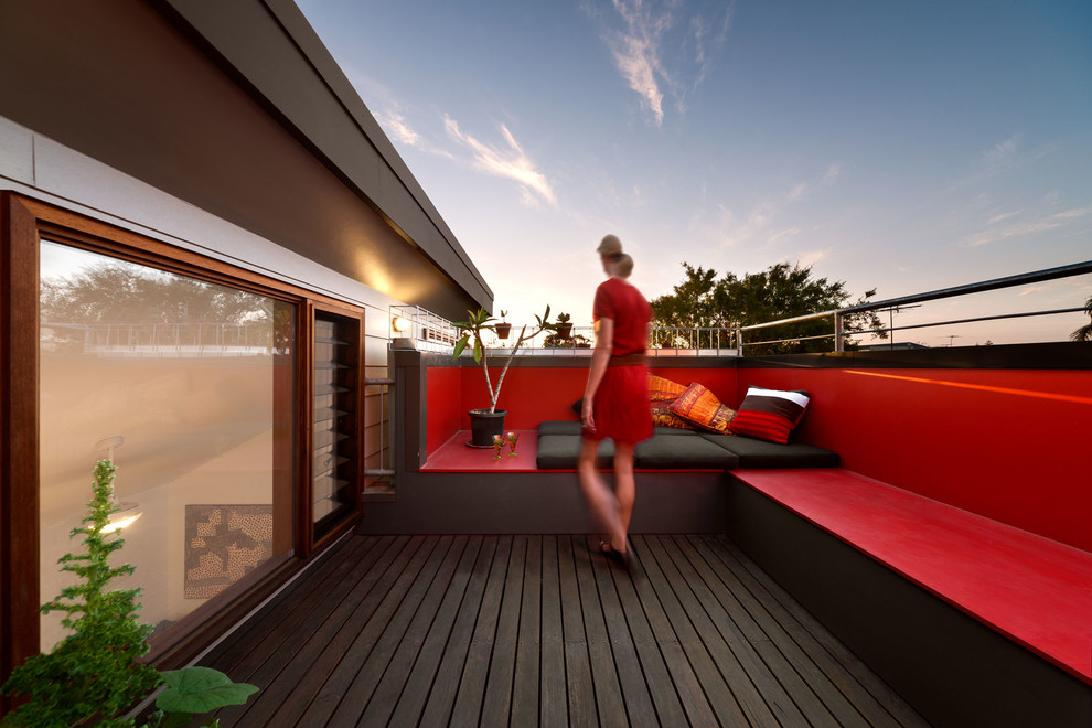 Design ideas for a small contemporary rooftop and first floor deck in Melbourne with with privacy feature, no cover and metal railing.