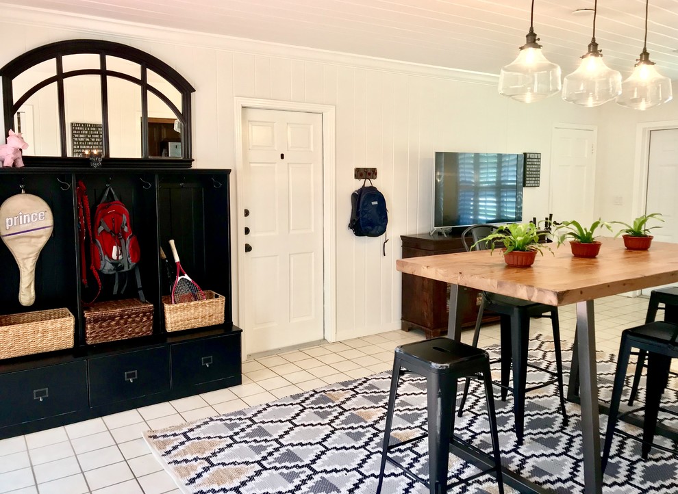 Inspiration for a mid-sized modern mudroom in Tampa with white walls, a single front door, a white front door, white floor and ceramic floors.