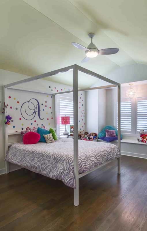 Inspiration for a large contemporary kids' bedroom for kids 4-10 years old and girls in Chicago with brown floor, white walls, dark hardwood floors, vaulted and wallpaper.