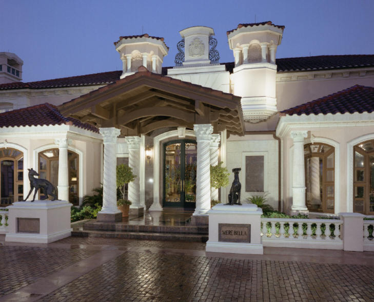 Design ideas for an expansive mediterranean three-storey stucco beige exterior in Los Angeles with a hip roof.