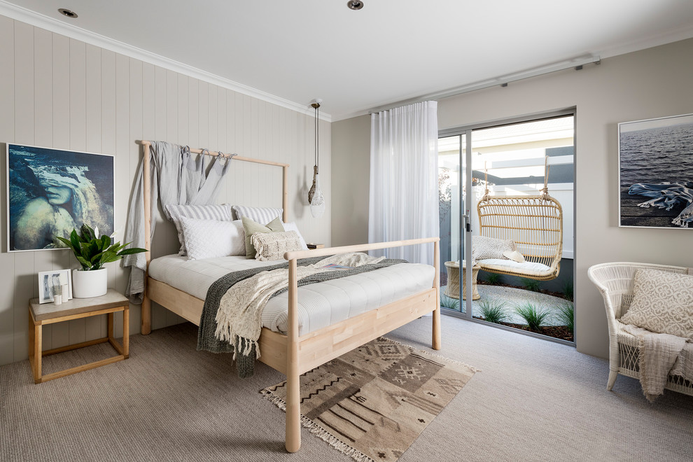 Beach style guest bedroom in Perth with beige walls, carpet and beige floor.