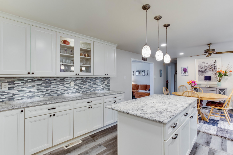 Inspiration for a large transitional u-shaped eat-in kitchen remodel in DC Metro with an undermount sink, granite countertops, stainless steel appliances and an island