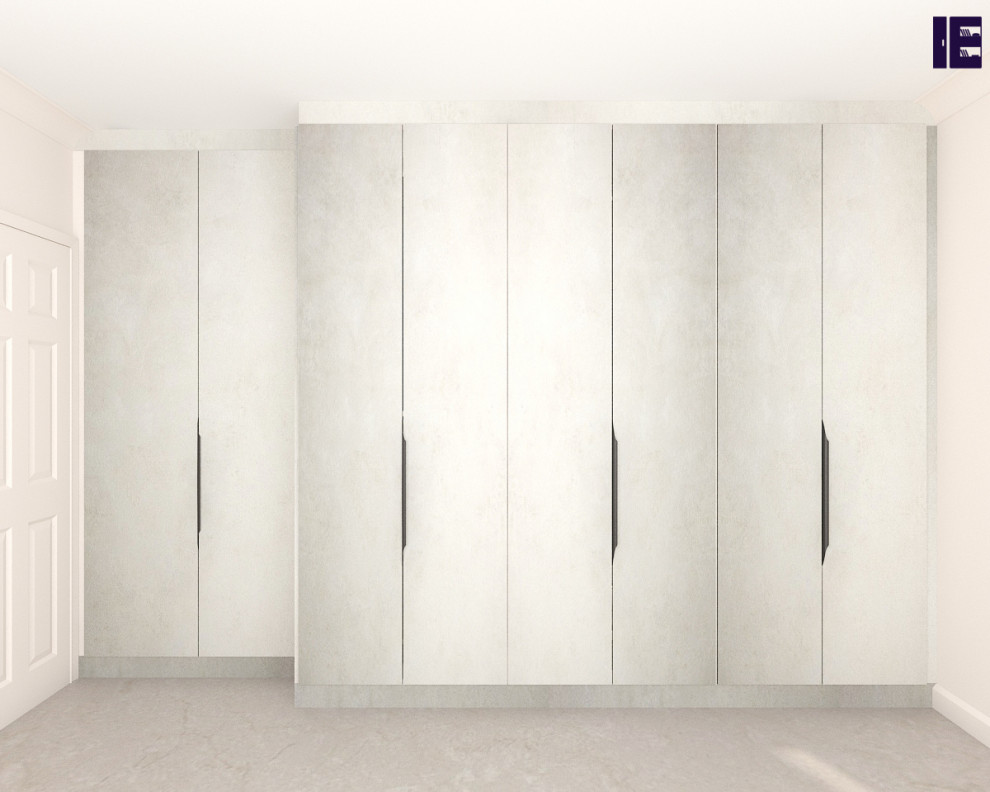 This is an example of a small contemporary storage and wardrobe in London with flat-panel cabinets and white cabinets.