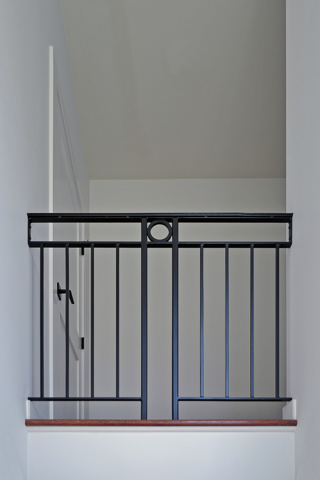 Small transitional hallway photo in Seattle with white walls