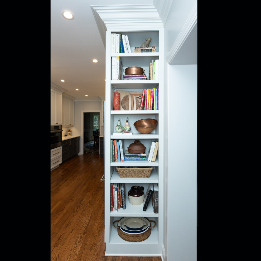 Inspiration for a mid-sized transitional galley medium tone wood floor and brown floor kitchen pantry remodel with an undermount sink, shaker cabinets, gray cabinets, granite countertops, white backsplash, ceramic backsplash, stainless steel appliances, no island and white countertops