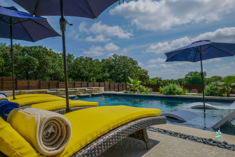 Inspiration for a huge mediterranean backyard custom-shaped infinity pool landscaping remodel in Dallas with decking