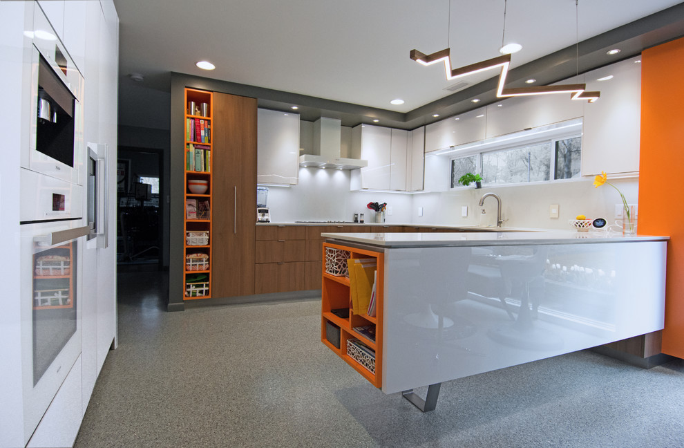 Design ideas for a mid-sized l-shaped eat-in kitchen in Charlotte with an undermount sink, flat-panel cabinets, white cabinets, quartzite benchtops, white splashback, engineered quartz splashback, stainless steel appliances, terrazzo floors, a peninsula, grey floor and white benchtop.