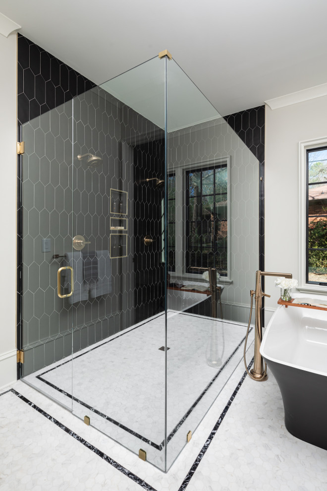 Photo of a traditional ensuite bathroom in Charlotte with beaded cabinets, black cabinets, a freestanding bath, a corner shower, white tiles, white walls, a built-in sink, marble worktops, a hinged door, white worktops, double sinks, a built in vanity unit and tongue and groove walls.