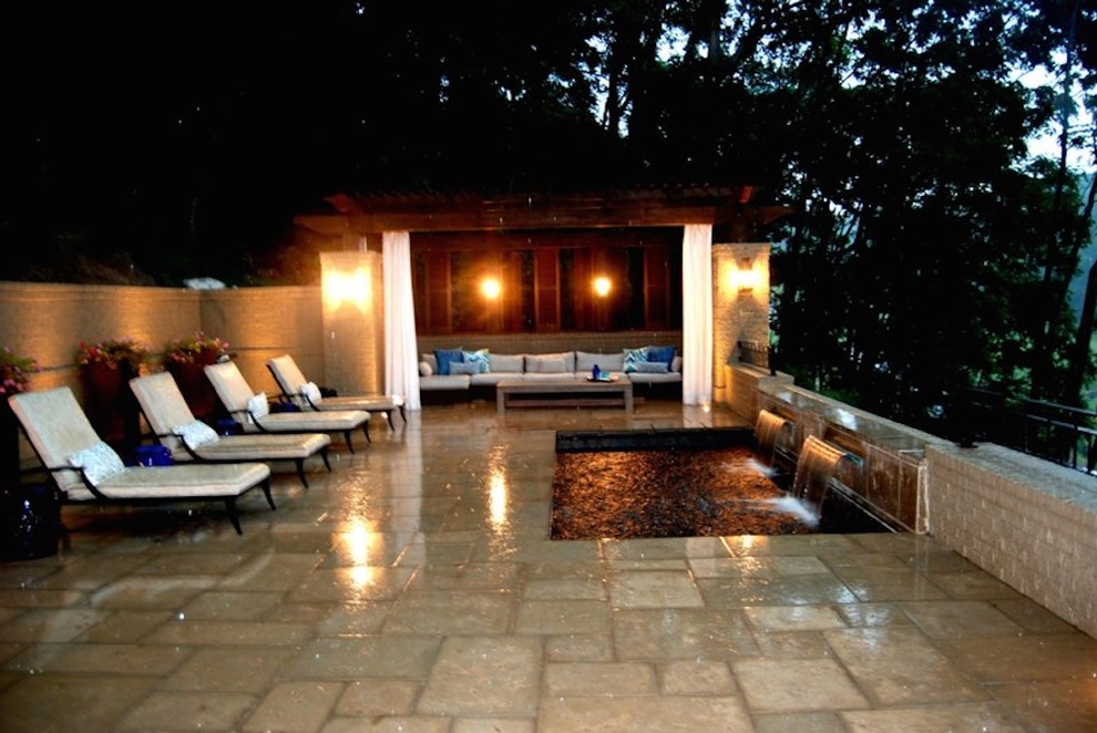 Inspiration for a mid-sized transitional backyard stamped concrete and rectangular pool fountain remodel in Nashville