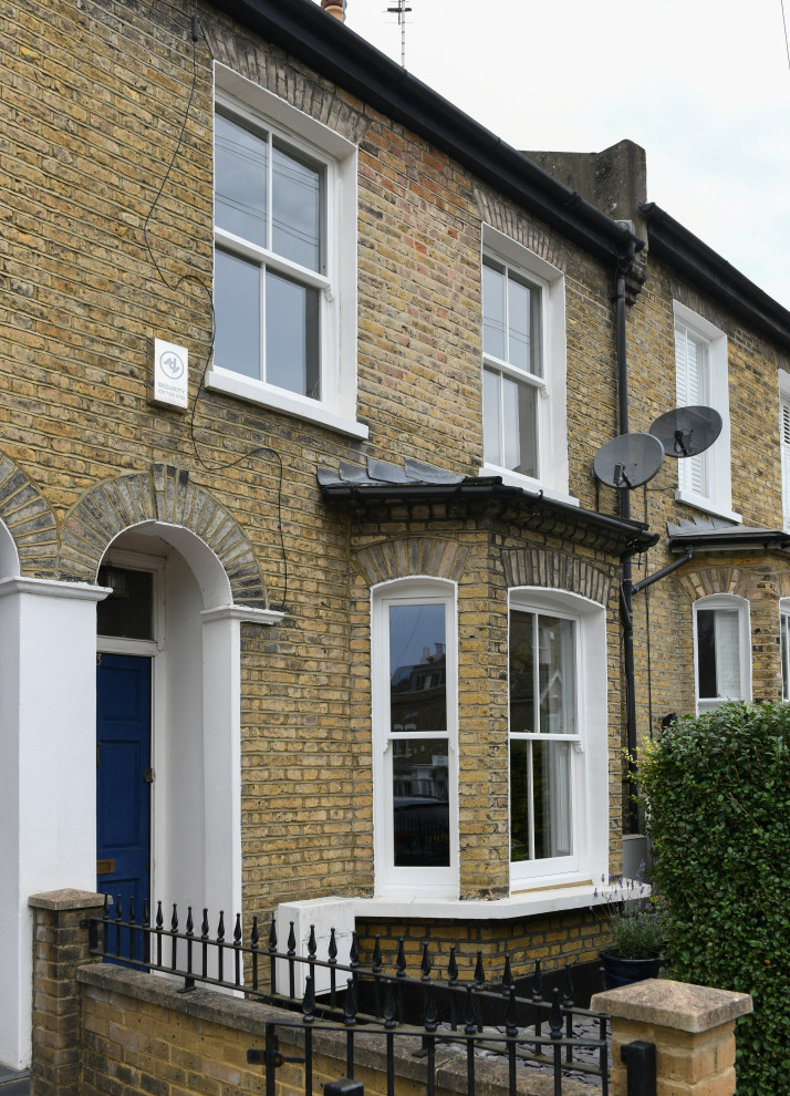 Photo of a traditional two-storey brick townhouse exterior in Berkshire.