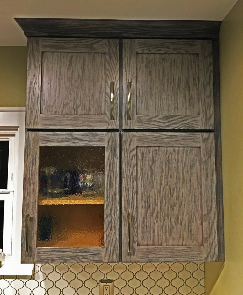 Small transitional galley enclosed kitchen photo in Seattle with an undermount sink, shaker cabinets, gray cabinets, quartzite countertops, white backsplash, ceramic backsplash, stainless steel appliances and no island