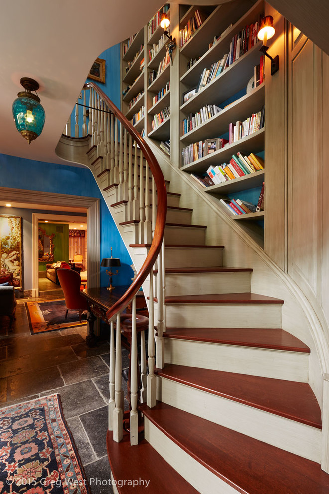 Mid-sized eclectic wood curved staircase in Boston with wood risers and wood railing.