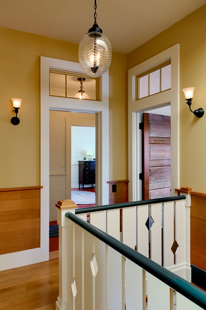 Design ideas for a country hallway in Burlington with beige walls and medium hardwood floors.