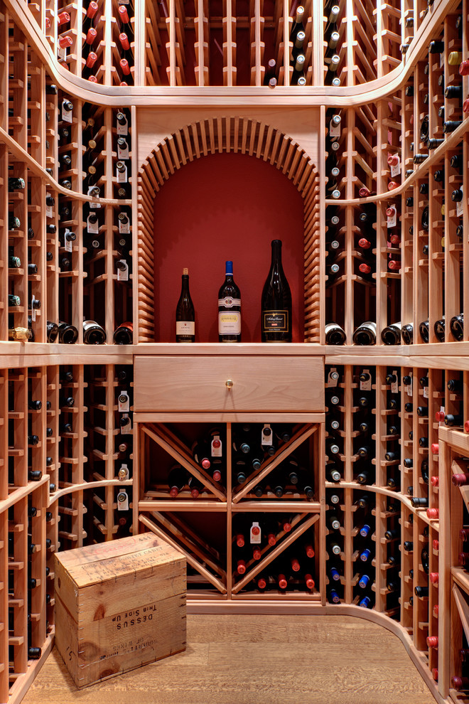 Design ideas for a traditional wine cellar in Portland with storage racks.