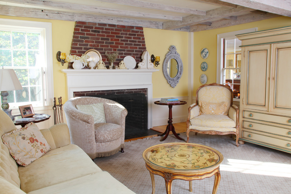 Mid-sized country formal enclosed living room in Boston with yellow walls, carpet, a standard fireplace, a brick fireplace surround and no tv.