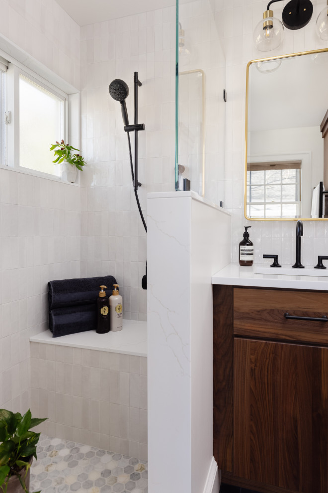 Example of a black floor and double-sink doorless shower design in Boston with dark wood cabinets, white walls, an undermount sink, quartz countertops, a hinged shower door, white countertops and a built-in vanity