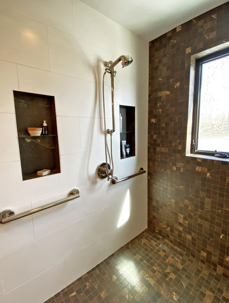 Mid-sized trendy master white tile and ceramic tile porcelain tile, brown floor, single-sink and wainscoting walk-in shower photo in Boston with flat-panel cabinets, dark wood cabinets, an undermount tub, a bidet, white walls, an undermount sink, marble countertops, a hinged shower door and a freestanding vanity