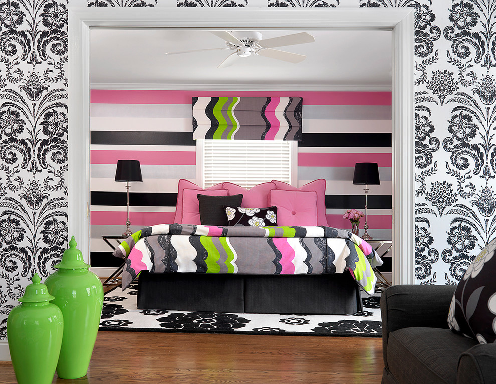 Inspiration for a mid-sized contemporary kids' room for girls in Other with multi-coloured walls and medium hardwood floors.