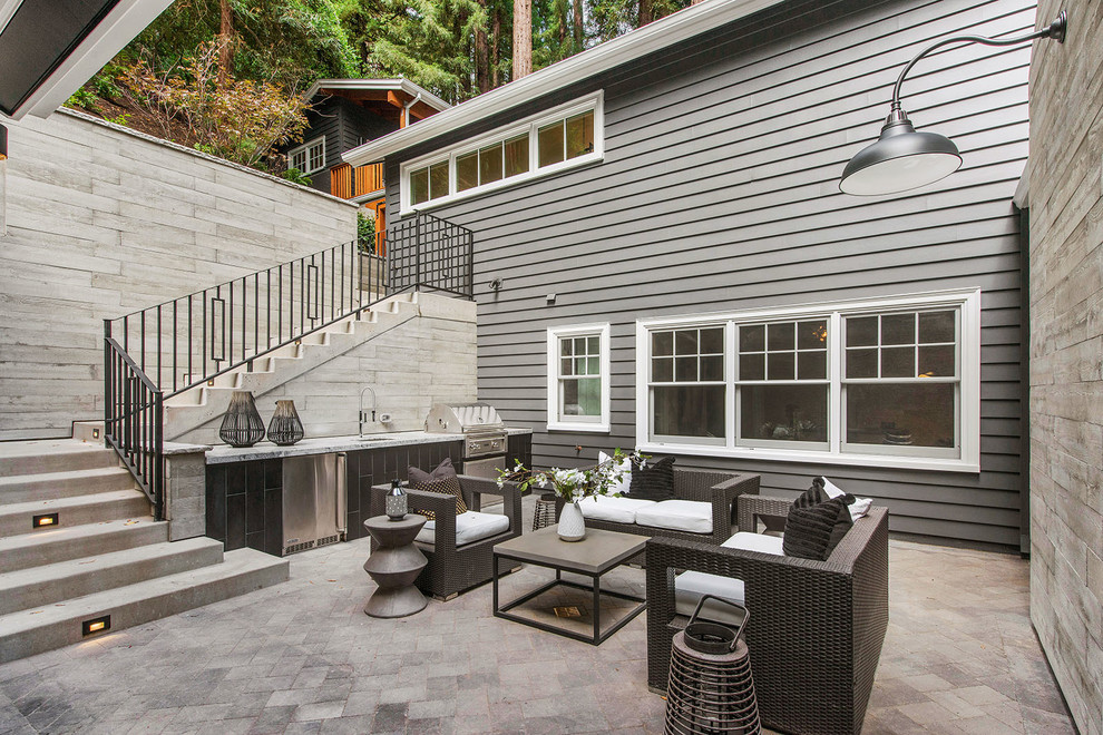 Inspiration for a mid-sized transitional courtyard patio in San Francisco with an outdoor kitchen, concrete pavers and no cover.