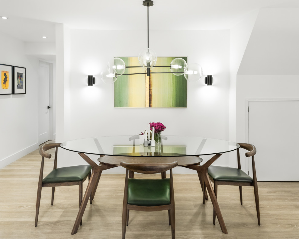 Mid-sized 1950s light wood floor and beige floor enclosed dining room photo in Toronto with white walls