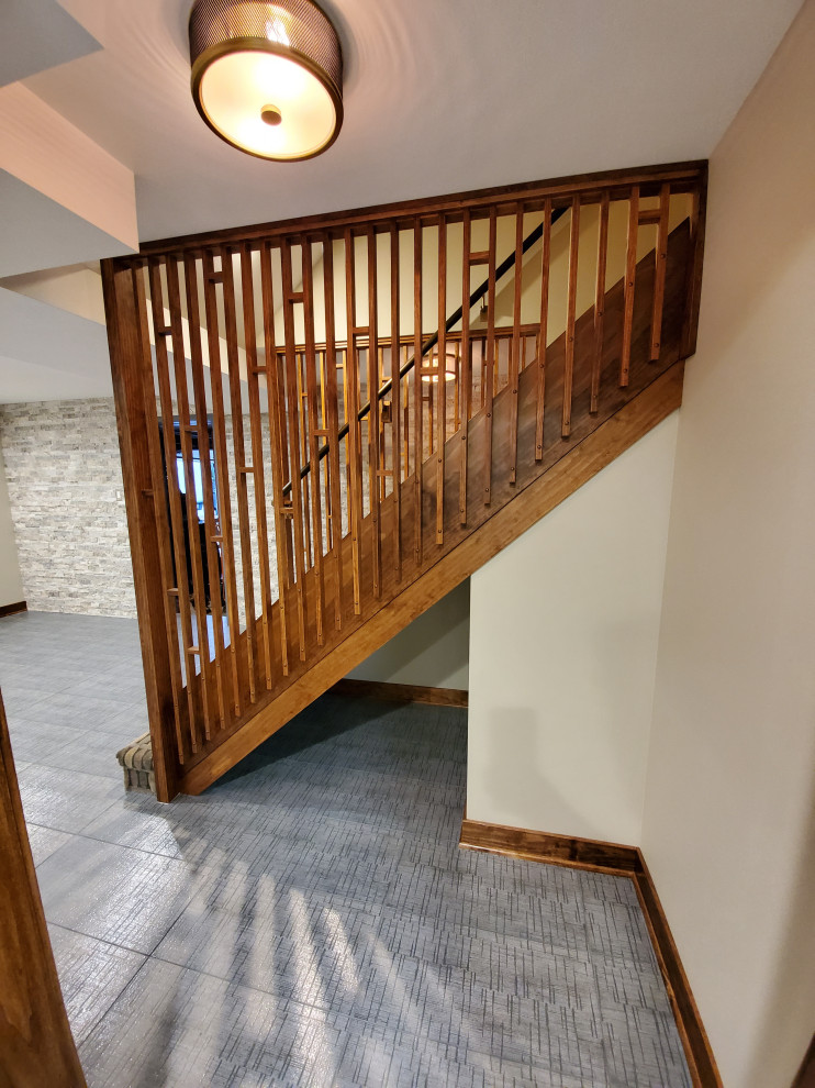 Diseño de escalera recta vintage de tamaño medio con barandilla de madera