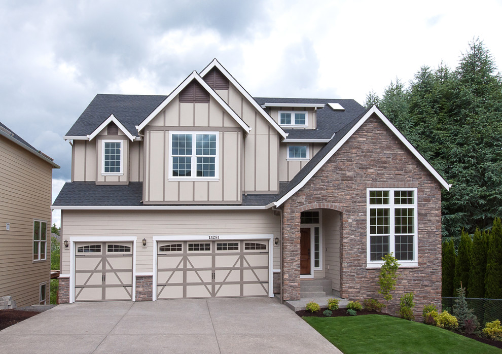 This is an example of a transitional two-storey exterior in Portland with stone veneer.