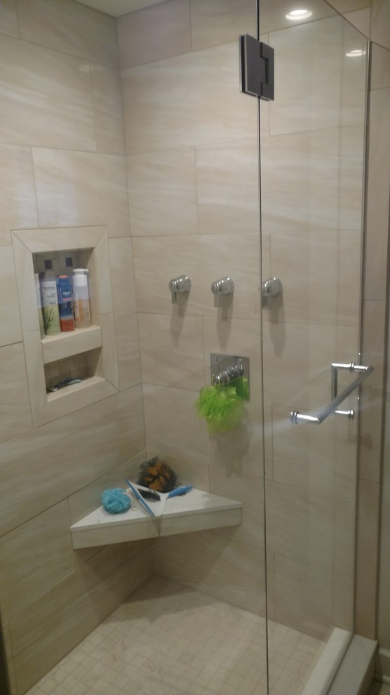 Mid-sized transitional 3/4 beige tile and porcelain tile alcove shower photo with beige walls and a hinged shower door