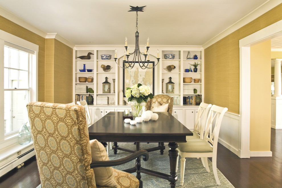 Inspiration for a beach style separate dining room in Providence with yellow walls and dark hardwood floors.