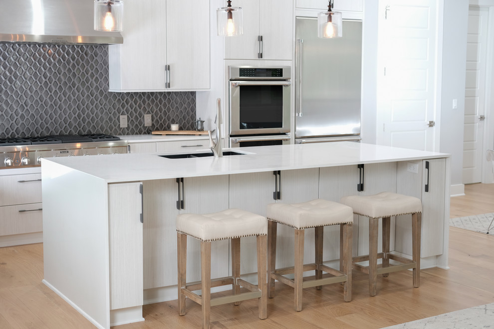 Example of a mid-sized transitional eat-in kitchen design in Austin