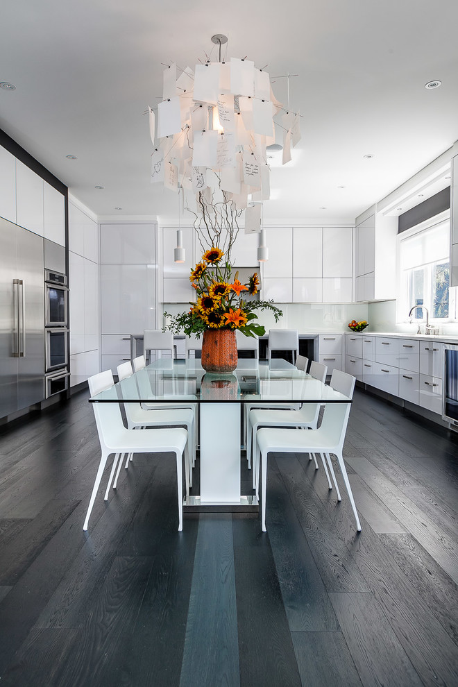 Photo of a contemporary kitchen/dining combo in Toronto with dark hardwood floors.