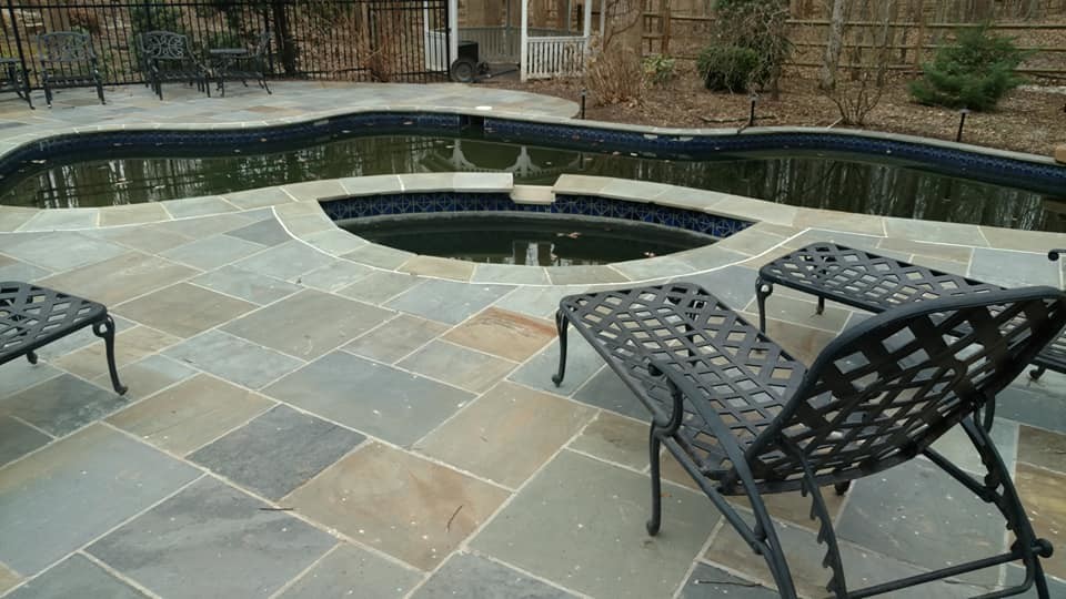 Huge transitional backyard stone and kidney-shaped natural pool photo