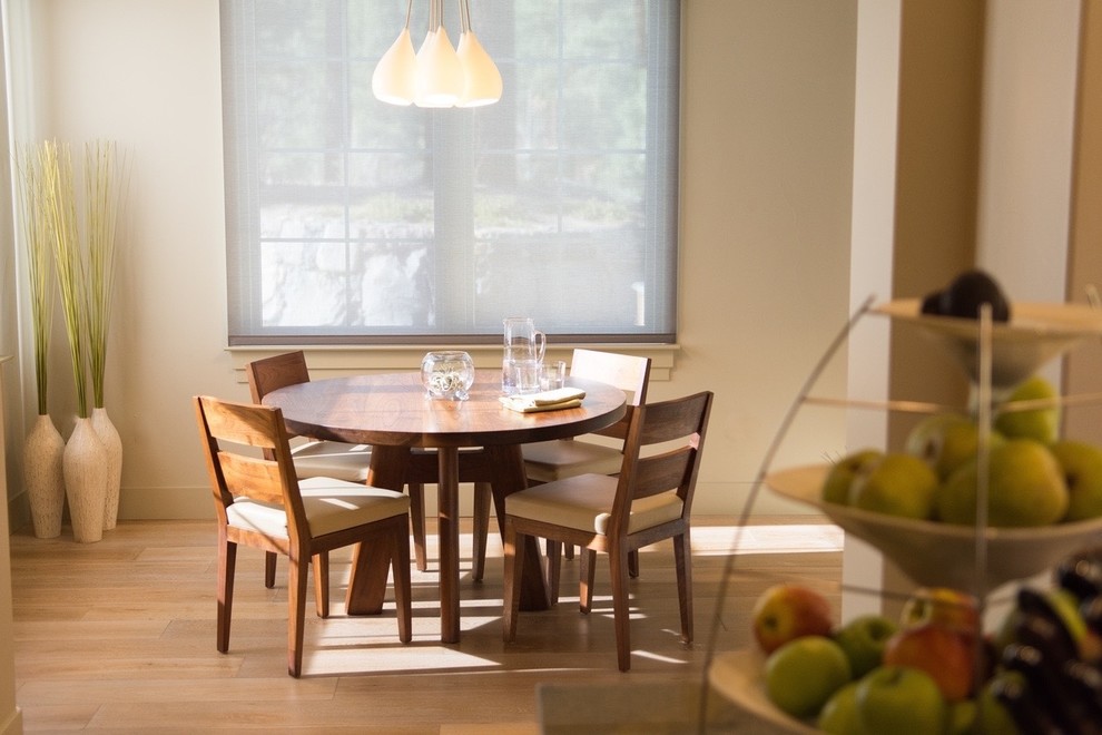 Inspiration for a contemporary dining room in Other with beige walls, light hardwood floors and brown floor.