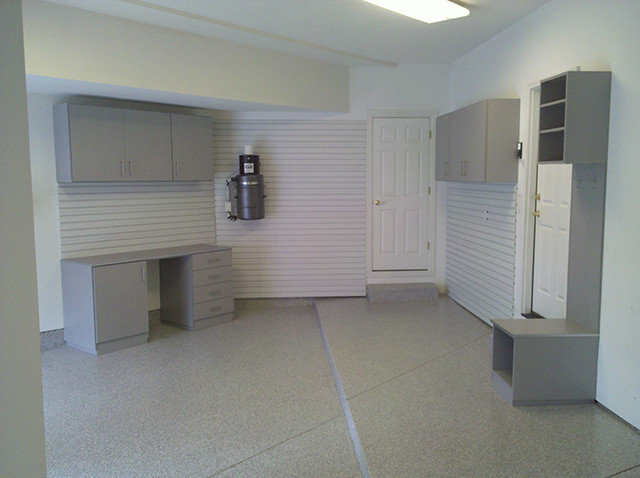 Garage workshop - large traditional attached two-car garage workshop idea in Denver