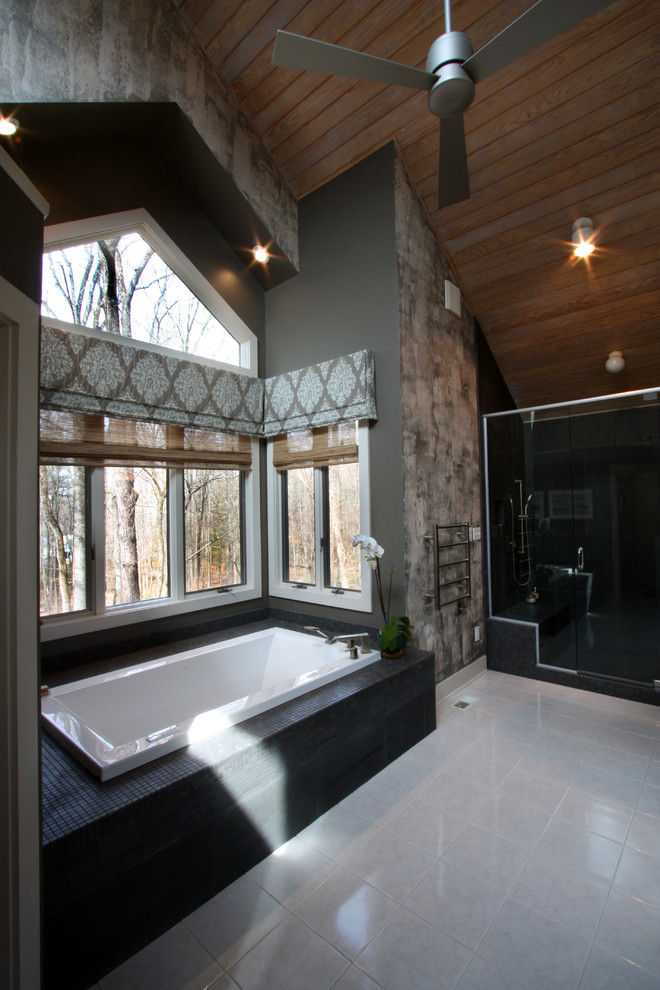 Expansive modern master bathroom in Richmond with a vessel sink, recessed-panel cabinets, dark wood cabinets, concrete benchtops, an alcove tub, a double shower, a one-piece toilet, black tile, stone tile, brown walls and ceramic floors.