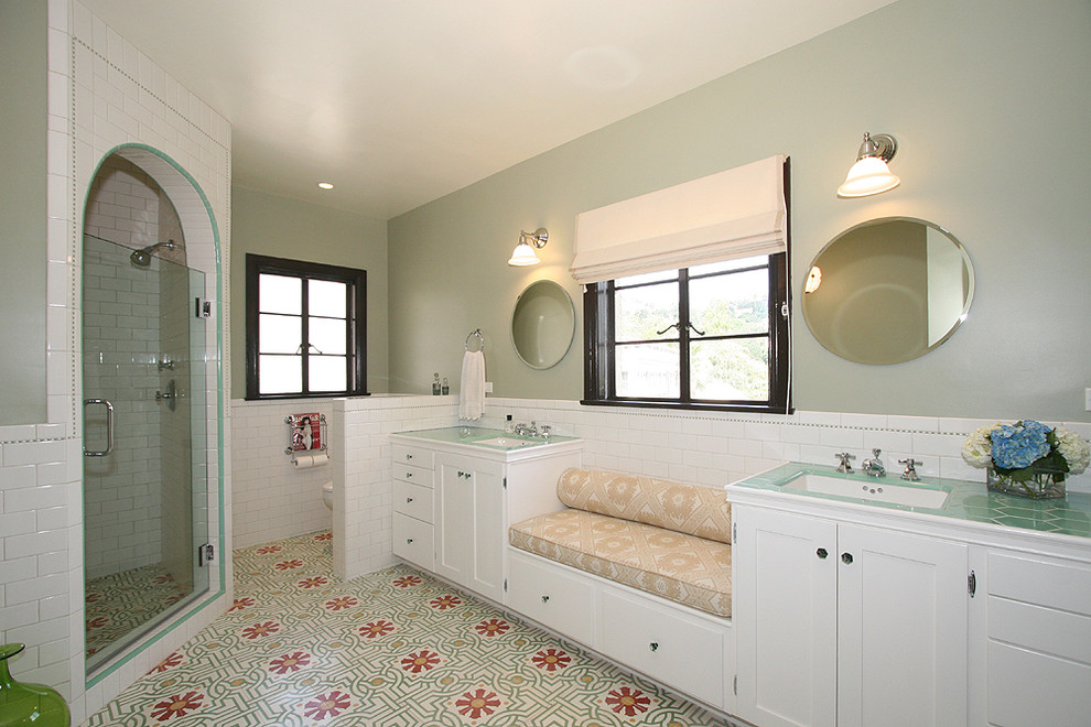 Photo of a traditional bathroom in Los Angeles with subway tile, tile benchtops and green benchtops.
