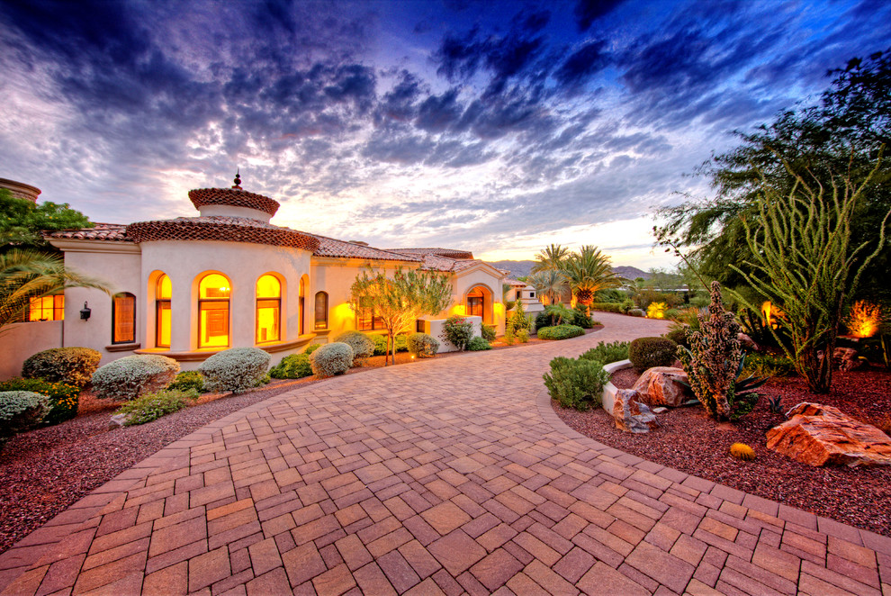 Inspiration for an expansive mediterranean one-storey stucco white exterior in Phoenix.
