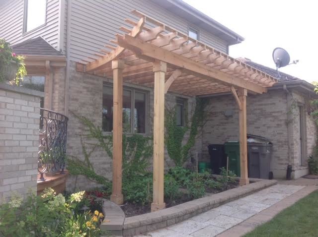 Inspiration for a traditional backyard patio in Chicago with decking and a pergola.