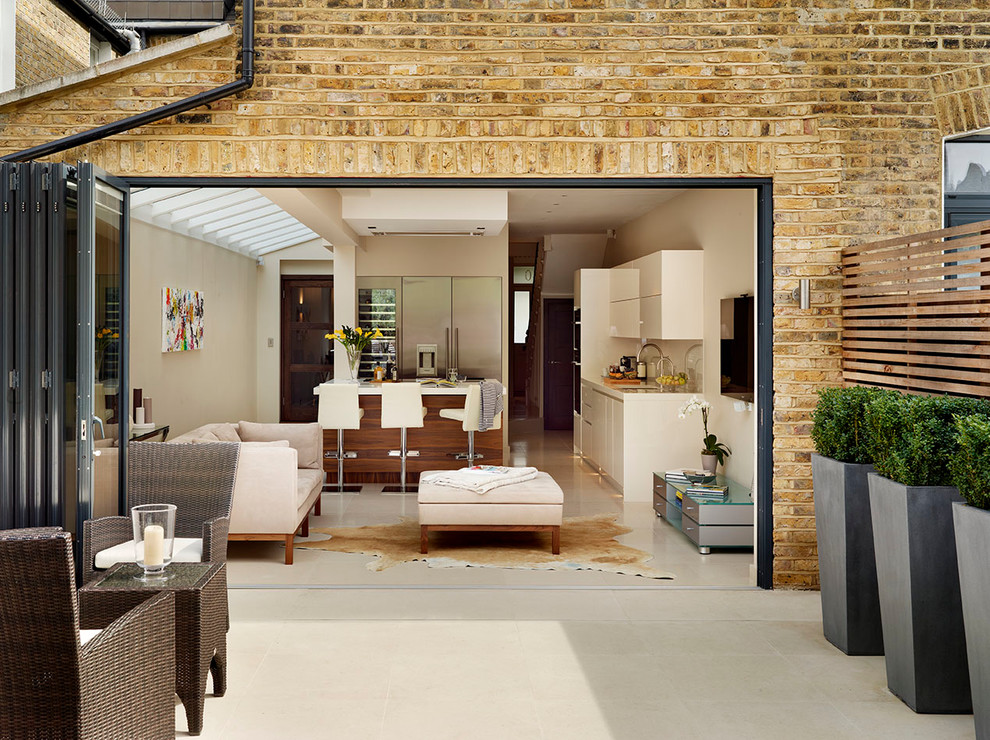 This is an example of a large contemporary patio in London.