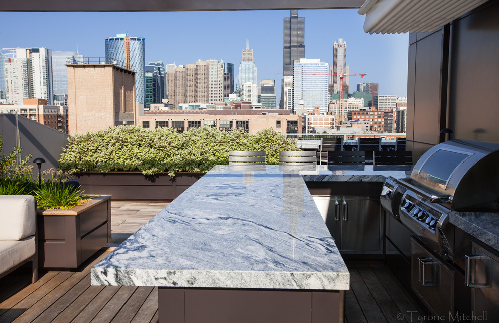 Minimalist rooftop deck photo in Chicago with a fire pit
