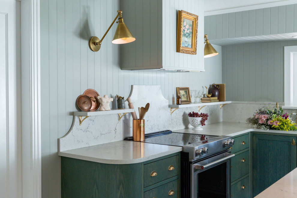 Kitchen - mid-sized transitional galley kitchen idea with recessed-panel cabinets, green cabinets, quartz countertops, white backsplash, quartz backsplash, stainless steel appliances and white countertops