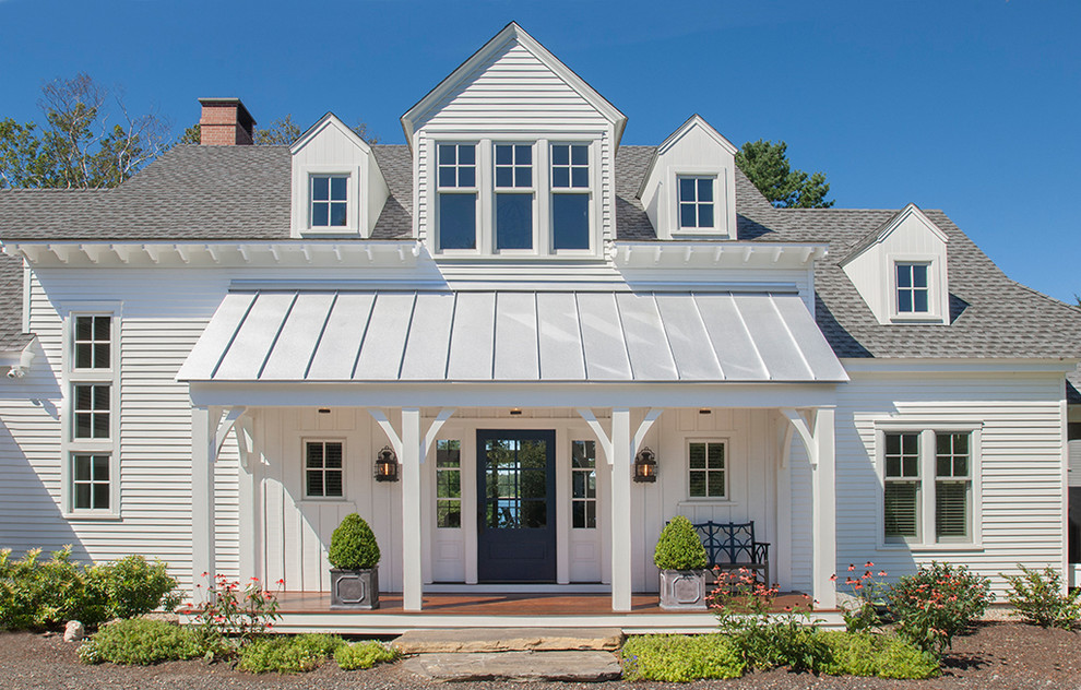 Inspiration for a country two-storey white exterior in Portland Maine with a mixed roof.