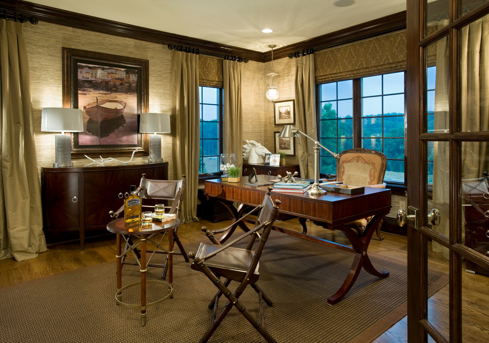 This is an example of a traditional home office in Philadelphia with dark hardwood floors and a freestanding desk.