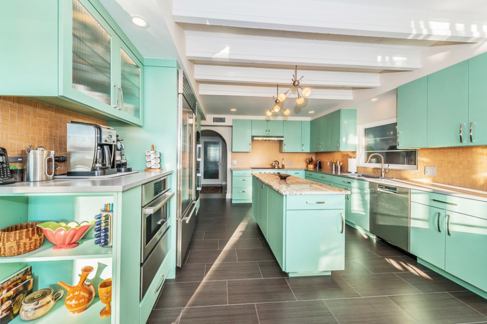 Large midcentury u-shaped eat-in kitchen in Tampa with an undermount sink, flat-panel cabinets, green cabinets, granite benchtops, beige splashback, ceramic splashback, stainless steel appliances, porcelain floors, with island, grey floor and beige benchtop.