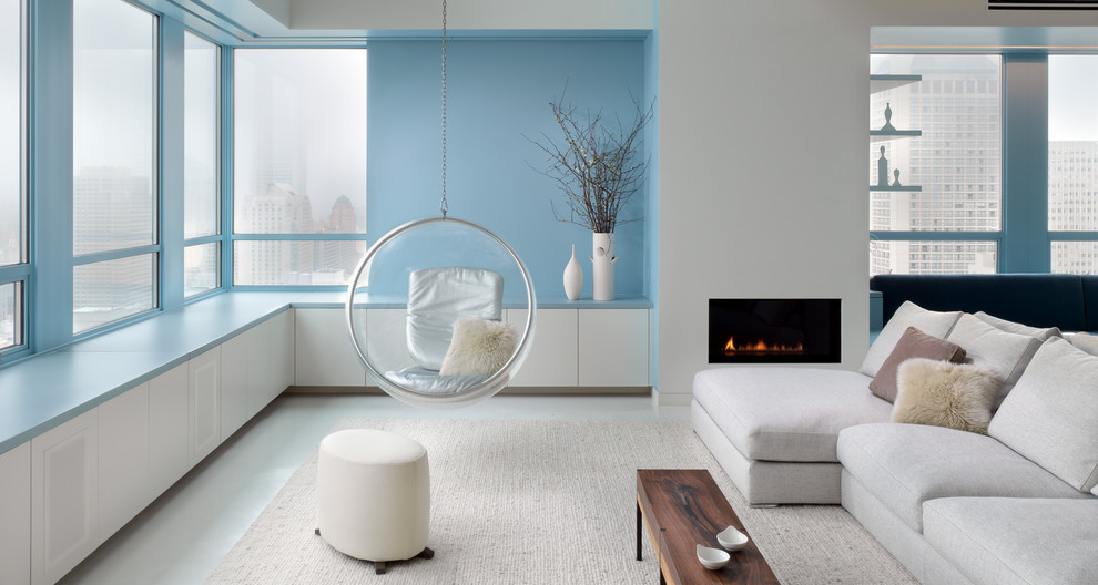 Inspiration for a contemporary formal open concept living room in San Francisco with blue walls and a ribbon fireplace.